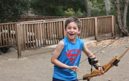 a boy holding a shovel