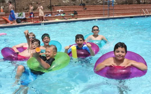 a group of people in a pool