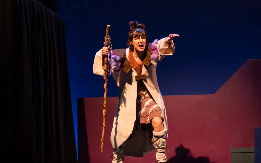 a person holding a stick