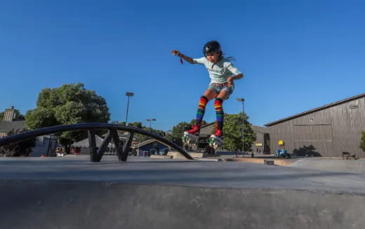 a person skating on a rail