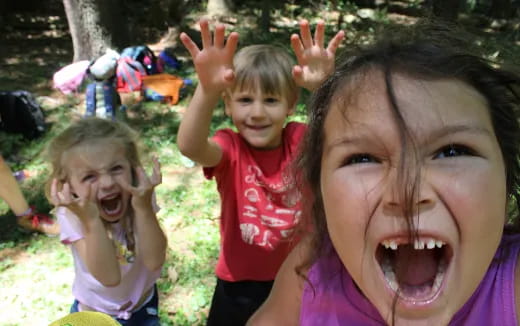 a group of children making faces
