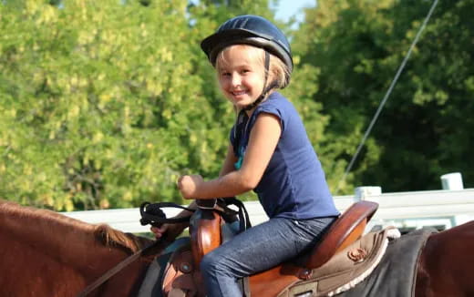 a girl riding a horse