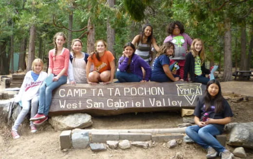 a group of people sitting on rocks