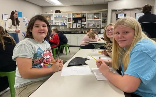 a group of people sitting at a table