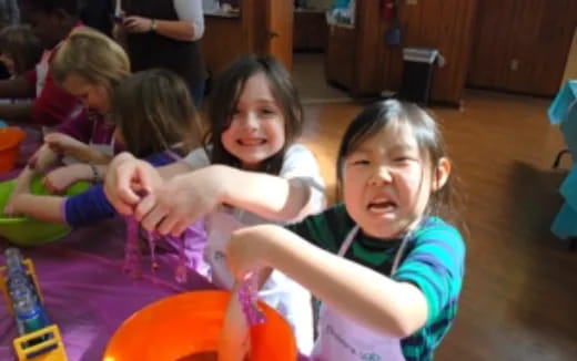 a group of children playing in a room