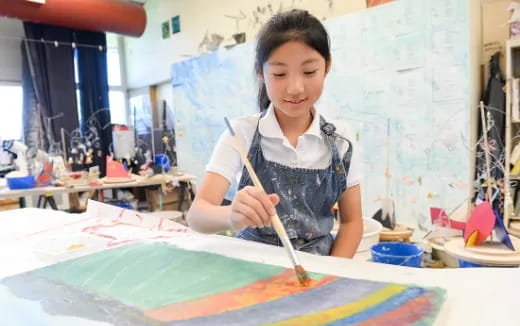 a young girl painting