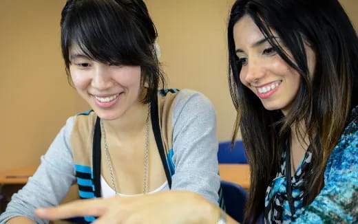 a couple of women smiling