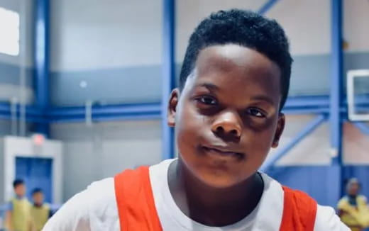 a boy in a white shirt