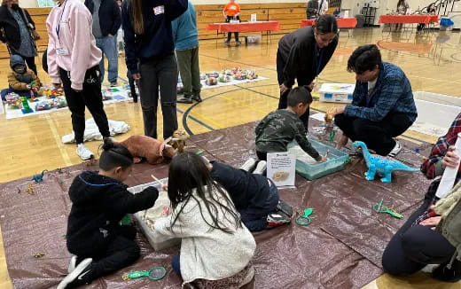 a group of people sitting on the ground