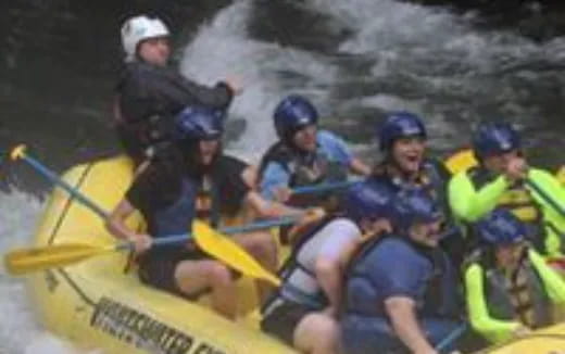 a group of people in a raft