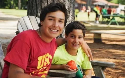 a person and a boy smiling