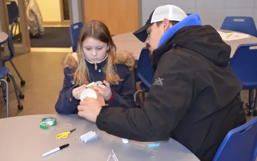 a man and a woman sitting at a table