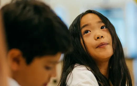 a woman looking at a man