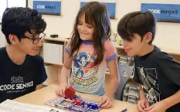 a group of children playing with a toy