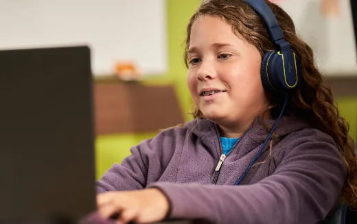 a young girl wearing headphones