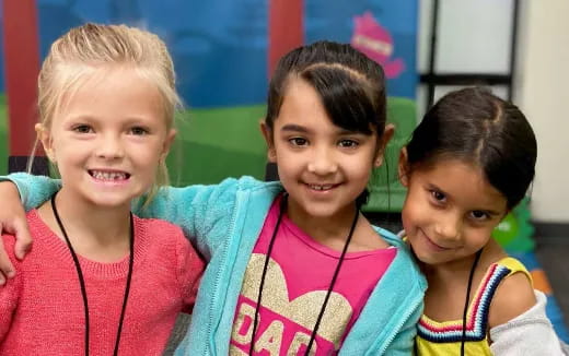 a group of girls smiling