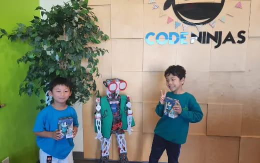 a couple of boys holding toys