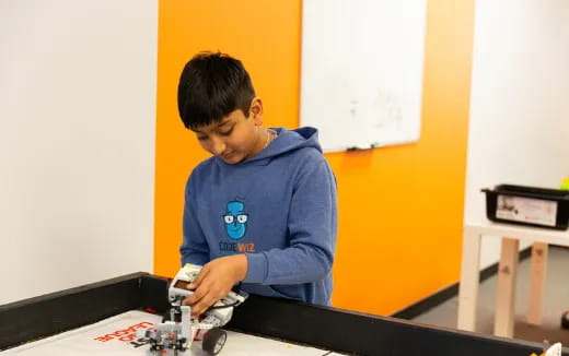 a boy using a toy