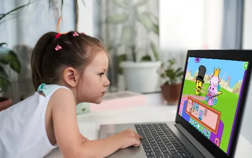 a young girl using a laptop
