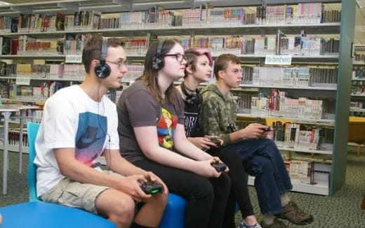 a group of people sitting in a library