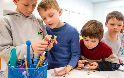 a group of kids playing with toys