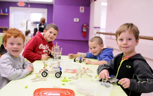 a group of boys playing with toys