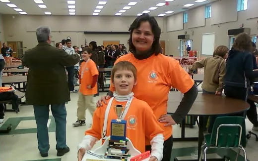 a person and a boy in an orange jumpsuit