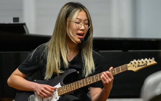 a person playing a guitar