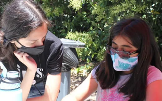 a girl and a boy with glasses