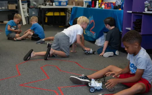 a group of kids playing with toys