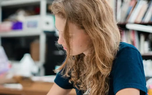 a woman with her hair blowing in the wind