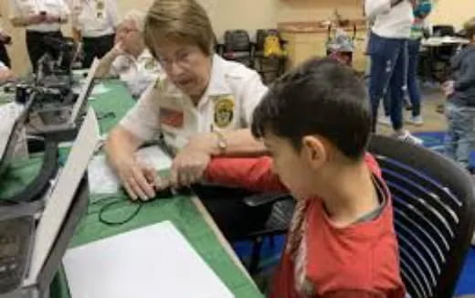 a few young boys working on a project