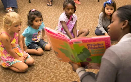 a group of children sitting on the ground