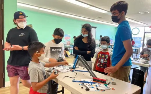 a group of people around a table