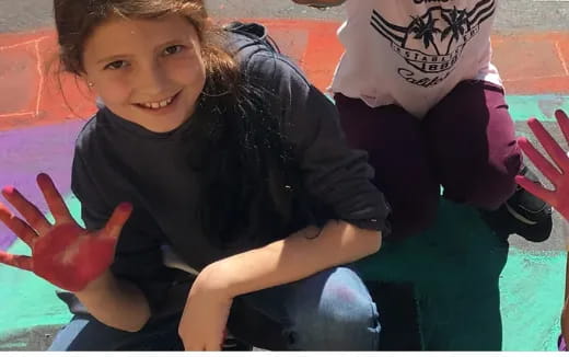 a boy sitting on a bench