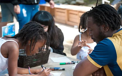 a few people sitting at a table