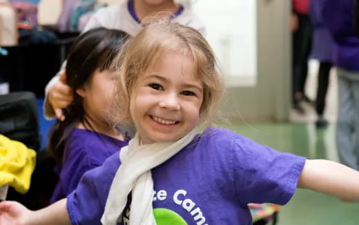 a girl smiling at the camera