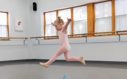 a child in a dress dancing