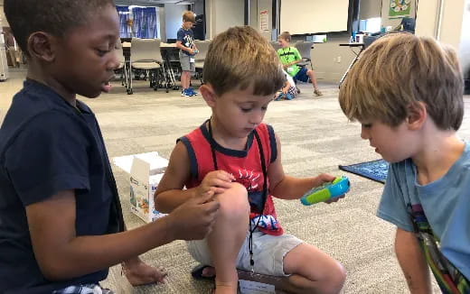 a group of boys playing with toys