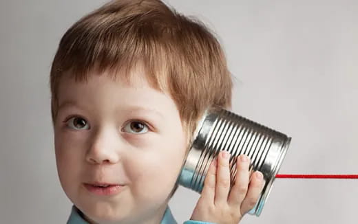 a boy holding a stethoscope