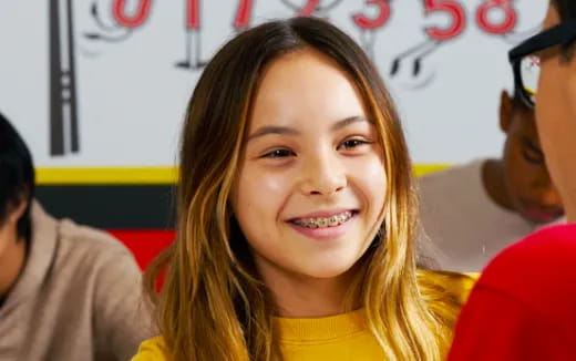 a person smiling at the camera