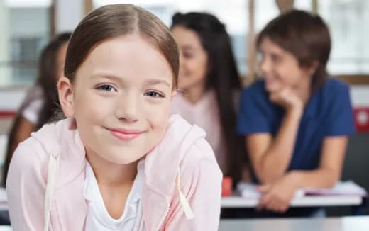 a young girl smiling