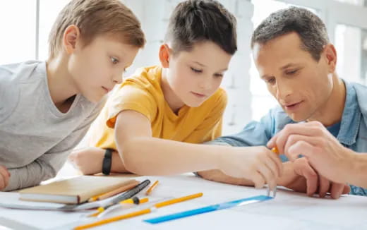 a few young boys studying