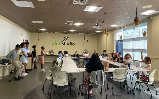 a group of people sitting at tables