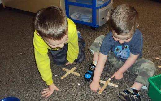 two kids playing with toys