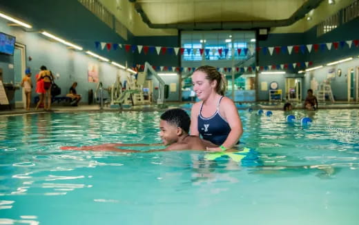 a man and woman in a pool