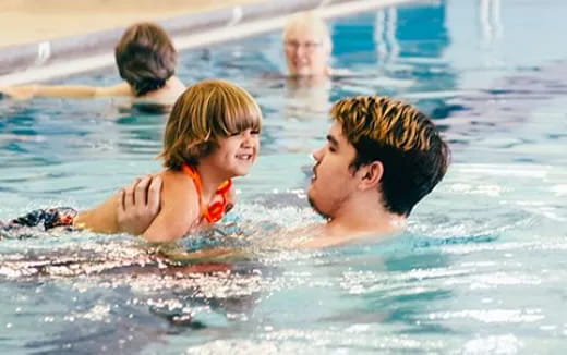 a man and a woman in a pool