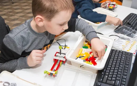 a boy playing with toys