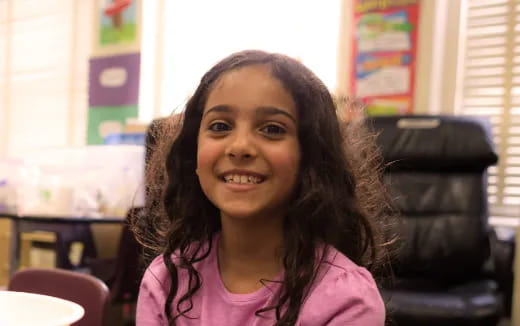 a girl smiling for the camera