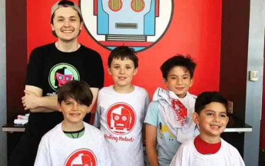 a group of boys posing for a photo
